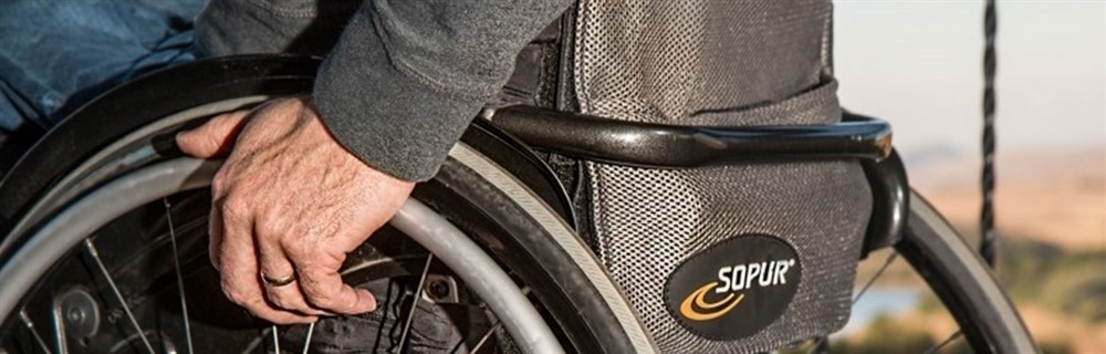 hand on wheelchair