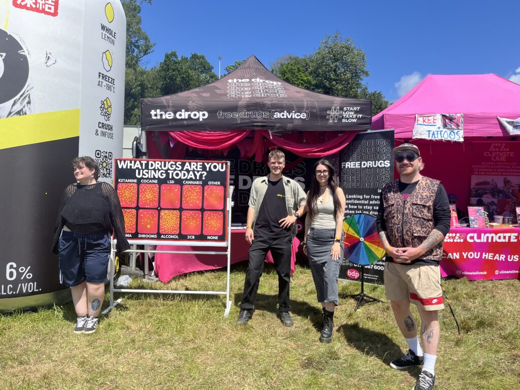 BDP workers at Love Saves The Day festival stood in front of The Drop's tent.